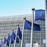 European flags on the background of the European Parliament
