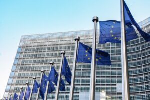 European flags on the background of the European Parliament
